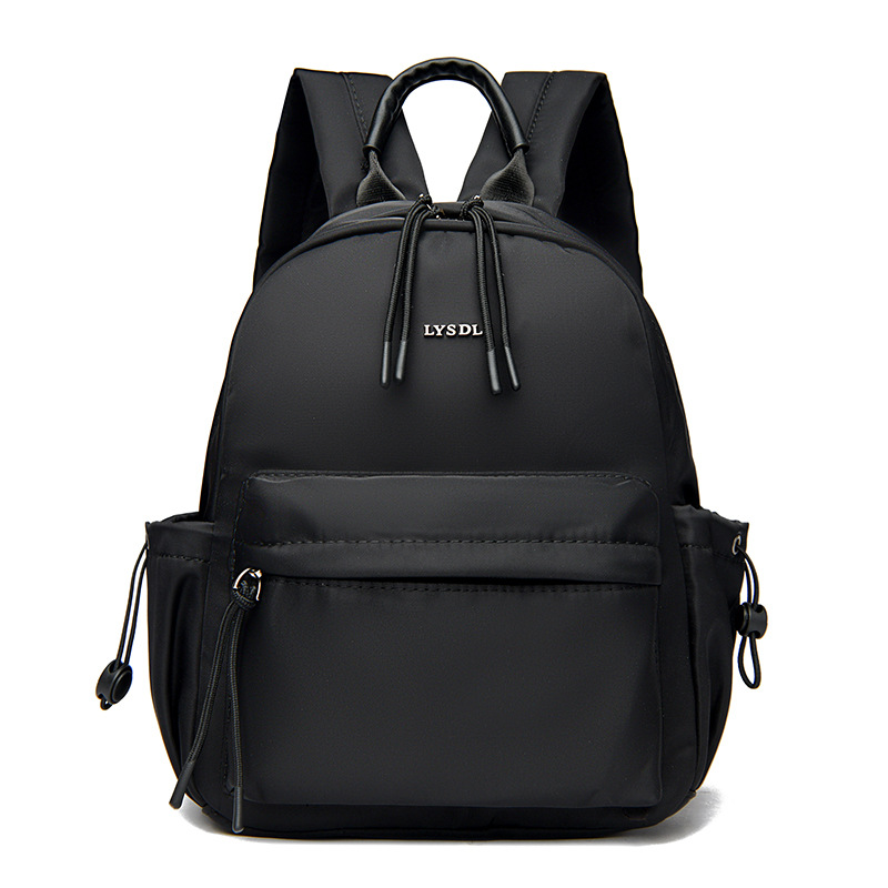 2025 nueva mochila de viaje simple de color sólido mochila de mujer casual letras extranjeras mochila de gran capacidad