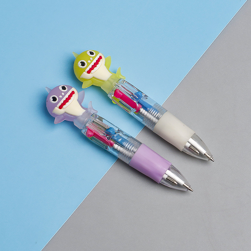 Fabricante mayorista de cuatro colores bolígrafo de silicona bolígrafo multicolor de dibujos animados cabeza portátil de estudiantes