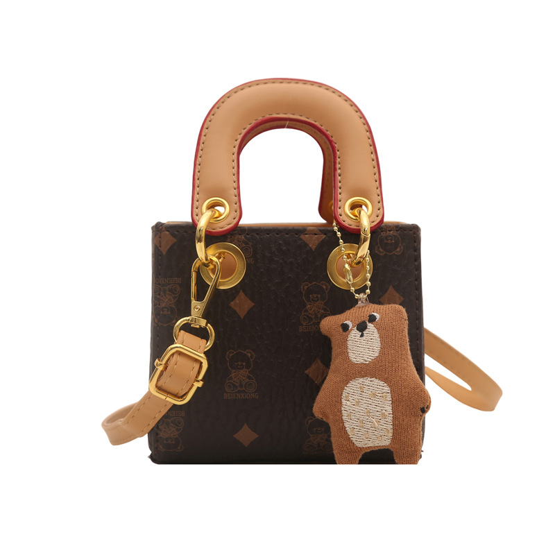 2026 nuevo bolso infantil caricatura lindo oso impresión bolso de hombro de moda mini bolso de bebé