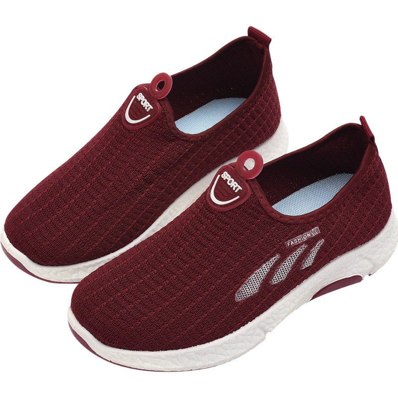 Zapatos casuales deportivos para mujer Otoño nueva moda todo-fósforo bajo-top tejido jogging slip-on zapatos de mujer zapatos para caminar al por mayor