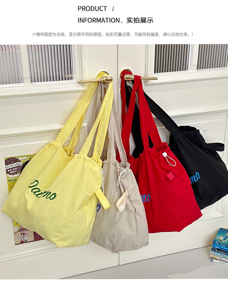 Solid color large-capacity tote bag 2025 bestseller, fashionable commuting lightweight handbag, laid-back style drawstring nylon bag for women undefined