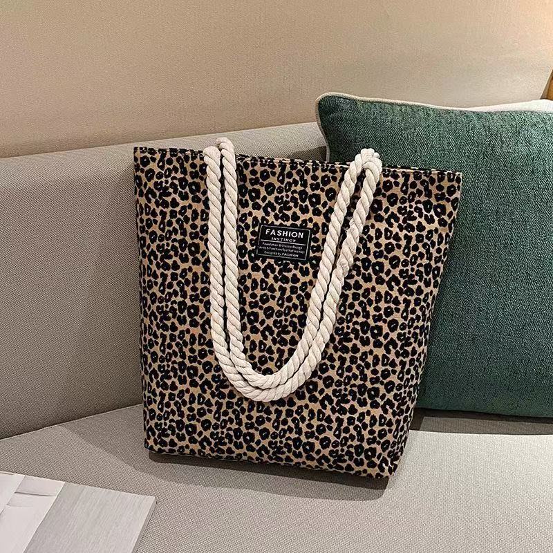 Bolso de mujer 2026 nueva impresión bolso de lona de moda leopardo coreano bolso de gran capacidad bolso de hombro de mano de compras