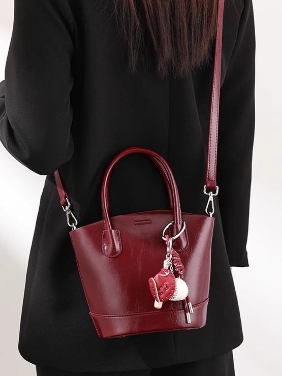 Alto sentido retro bolso de cubo rojo para mujeres otoño invierno nicho bolso de boda bolso portátil de viaje