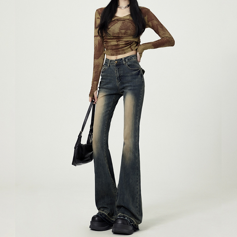 レトロな水洗いのジーパンの女性の腰の小さいラッパの2025の新型の秋のアメリカの毛の縁の設計感のラッパの馬蹄のズボン