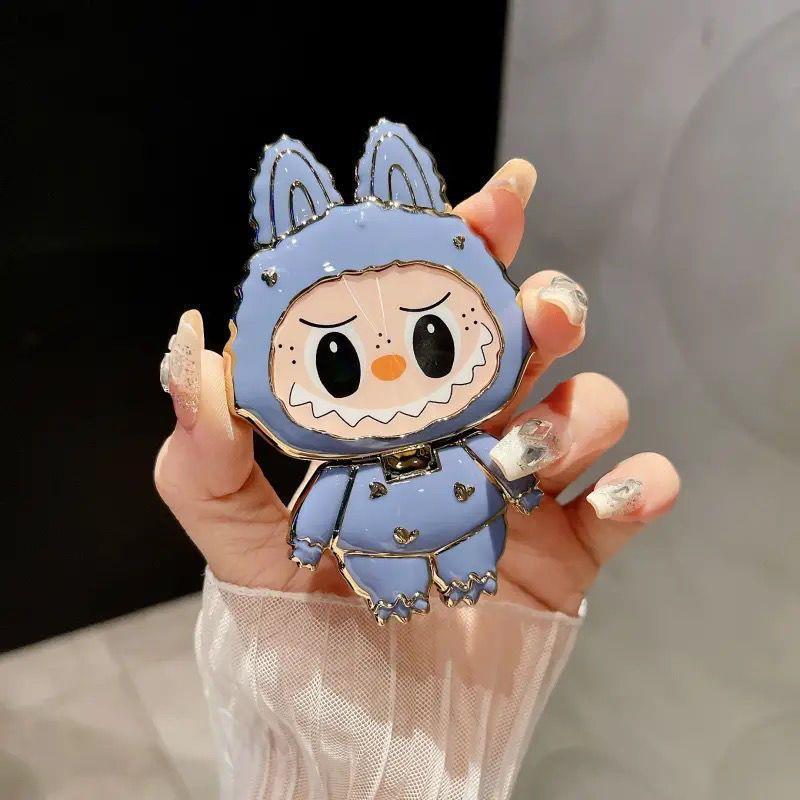 漫画かわいいラブブ携帯電話ホルダーラブブ化粧鏡ホルダーミラー携帯電話ホルダーは回転して折りたたむことができます|undefined