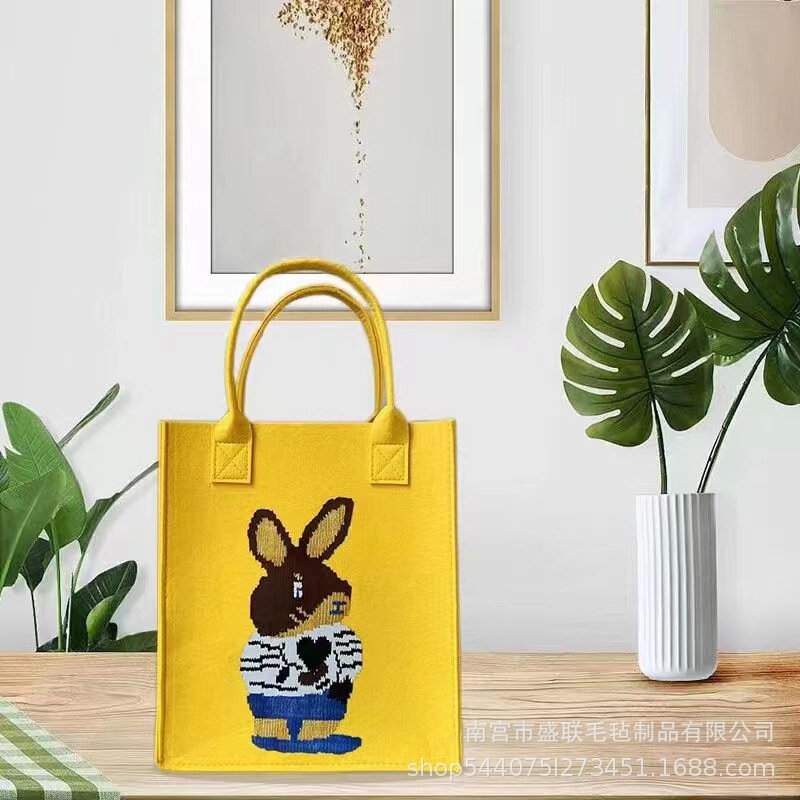 新しいキャラクターのプリントフェルトのハンドバッグとプレゼントの袋の軽い贅沢な簡単な出勤のショッピングバッグ|undefined