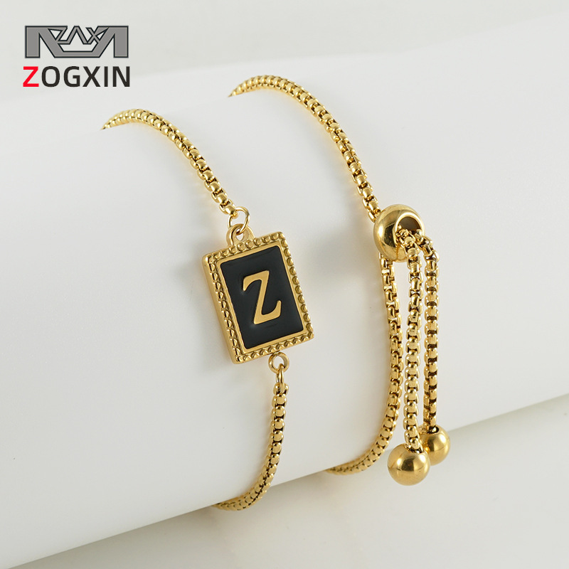 La moda europea y americana transfronteriza del acero inoxidable 26 pulsera inglesa de la letra en relieve pulsera Titanium de la cremallera del acero 18K de la frontera para las mujeres