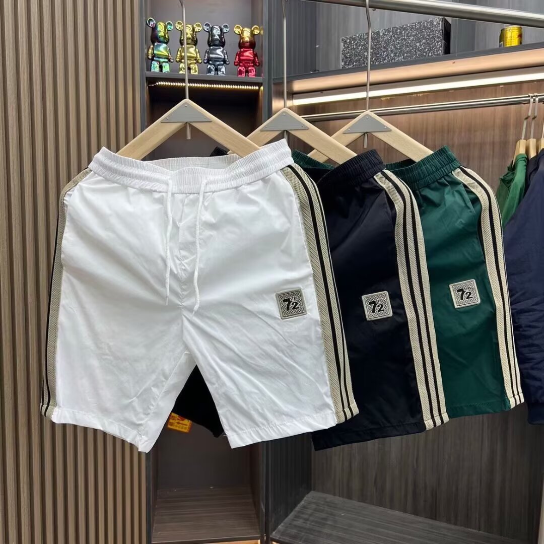 Pantalones cortos de cinco puntos para hombres de verano delgados de moda de alta calidad simple versátil suelta pantalones de playa