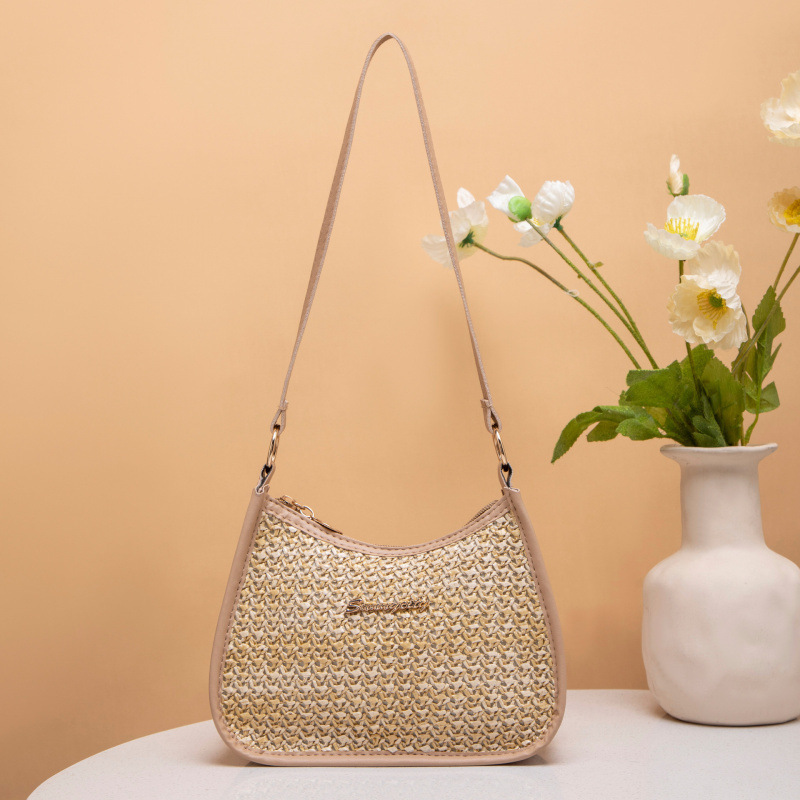 Fresco dulce 2025 nuevo bolso de paja de mujer, bolso de hombro de moda versátil, bolso de brazo de mujer nicho