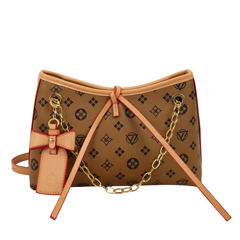 Bolso de cadena de textura transfronteriza 2025 verano nuevo bolso femenino retro bowknot bandolera moda contraste color bandolera