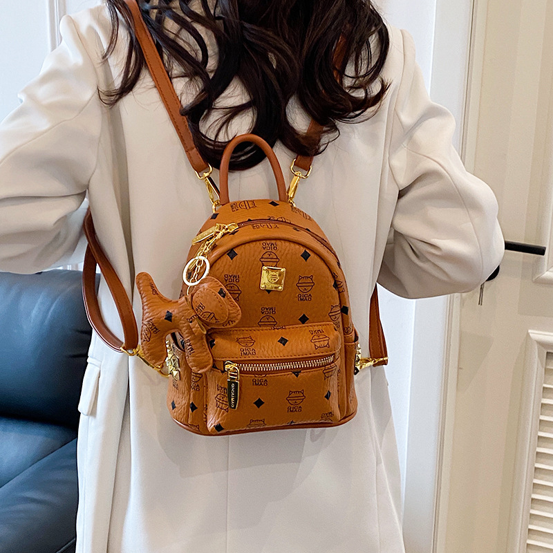 2025 nueva mochila de mujer lindo oso impresión de aire extranjero mochila de estudiantes universitarios para trabajar bolsas de mujer