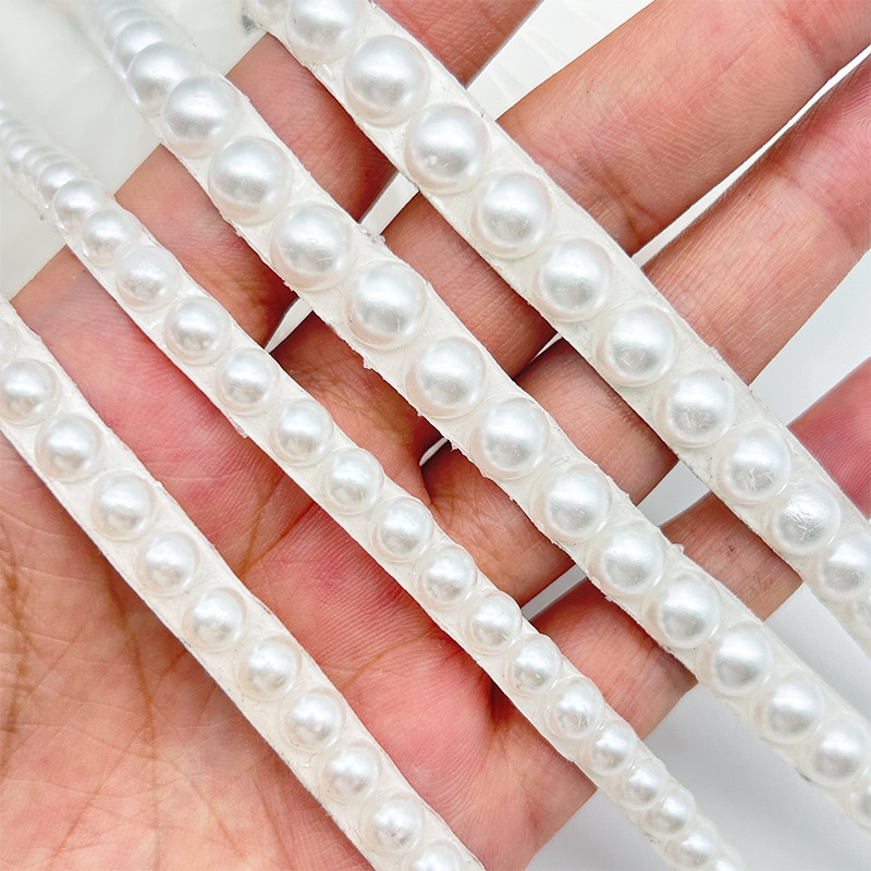 Nuevo producto Venta caliente Perla Tela de diamantes de imitación Adhesivo de fusión en caliente Diamante autoadhesivo Tela de diamantes flash Bolso de ropa Diy Cinta de diamantes de imitación de cerámica