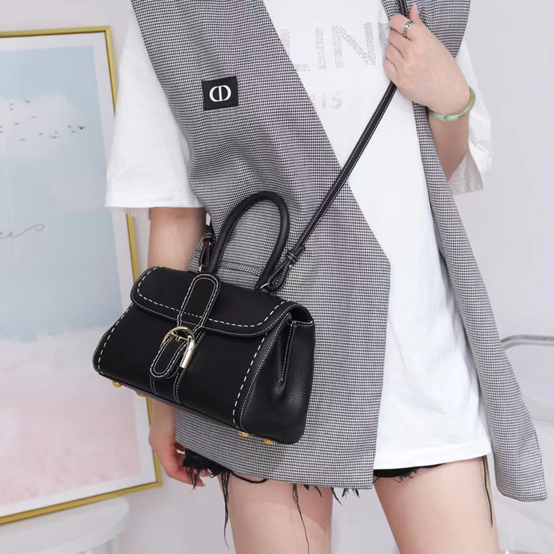 Bolso de mano con hebilla de herradura, modelo nuevo de 2025, bandolera de cuero de vaca granulado de primera capa, bolso de sillín informal y versátil.