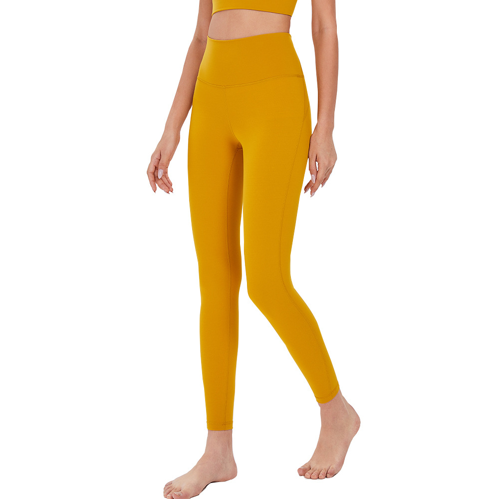 Pantalones de Yoga de cintura alta desnuda europea y americana de las mujeres Peach Hip lifting Pantalones deportivos ajustados pantalones de fitness de secado rápido