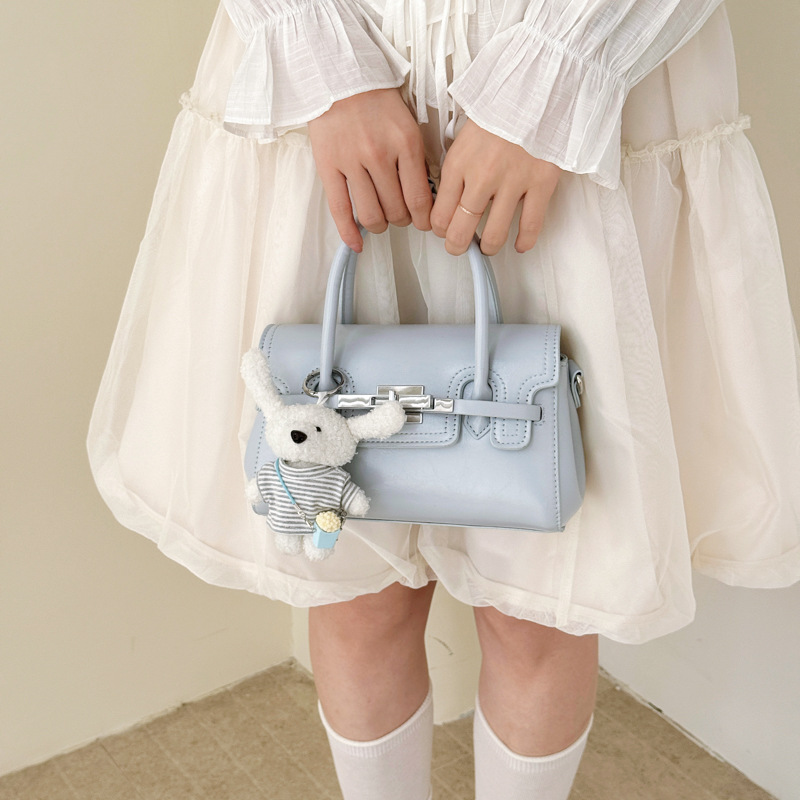 Bolso cuadrado pequeño exquisito, bolso de mano simple, 2026 nuevo tipo de tela, bolso de hombro de mujer, sensación diaria, bolso de hombro universal