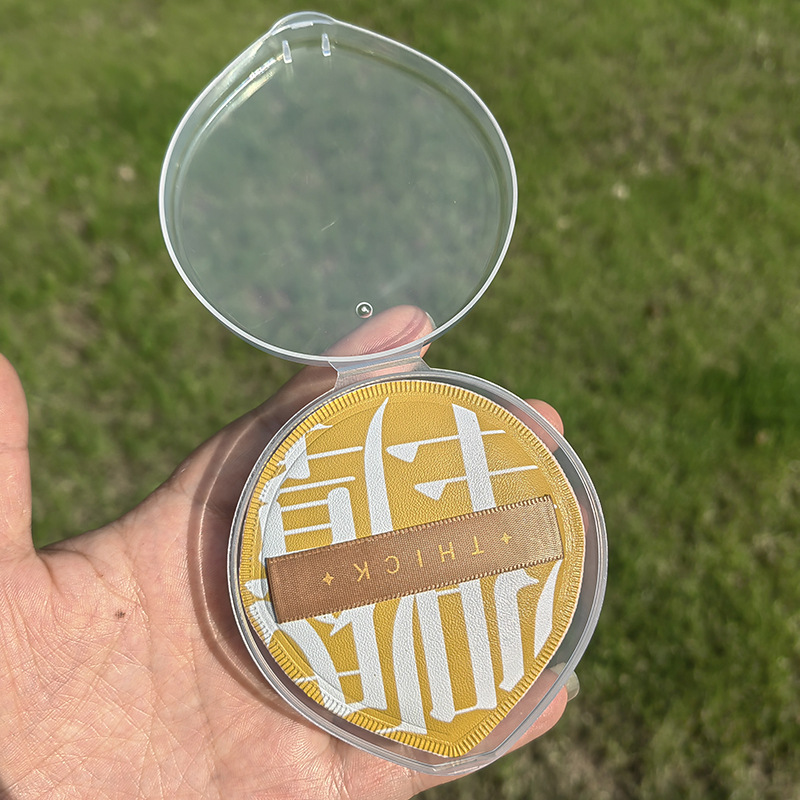 Puff polvo húmedo y seco de algodón de azúcar colchón de aire soplo de polvo al por mayor esponja de maquillaje superficie de cuero triángulo caja de almacenamiento de soplo de polvo