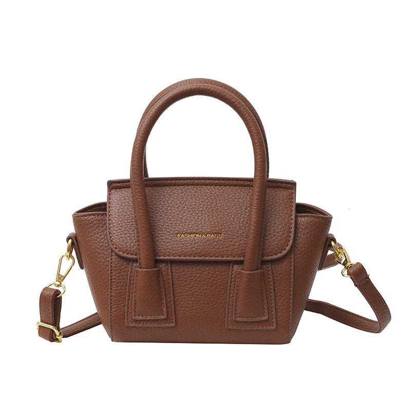 Bolsos populares de este año 2025 primavera nuevo bolso femenino casual patrón de lichi bolso de hombro letra todo fósforo bolso de mensajero