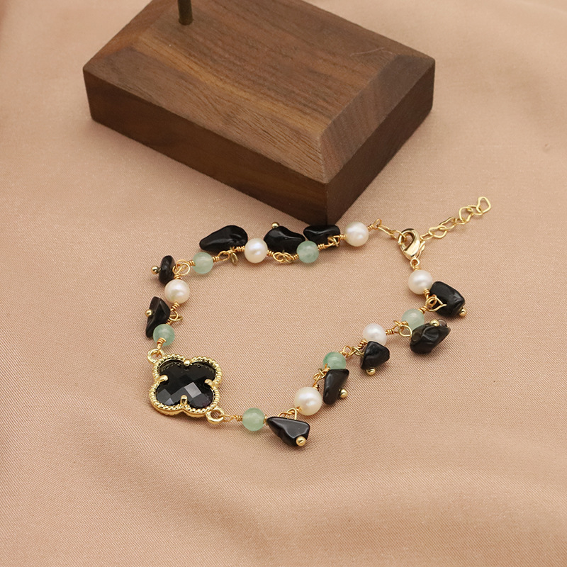 Pulseras de perlas de agua dulce naturales retro elegante pulseras de cuatro hojas negras europeas y estadounidenses el mismo joyería de empalme de oro 18k