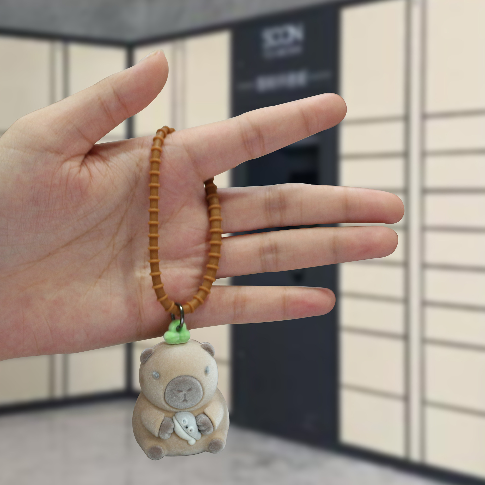 Explosiones transfronterizas flocado nutria llavero de caricatura tridimensional muñeca llavero colgante llavero de bolso