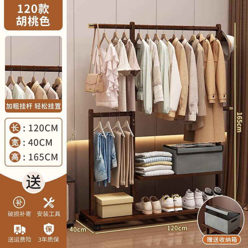La percha aterrizó en el dormitorio, la barra de almacenamiento para colgar la ropa en el hogar, el estante de ropa de la habitación junto a la cama.