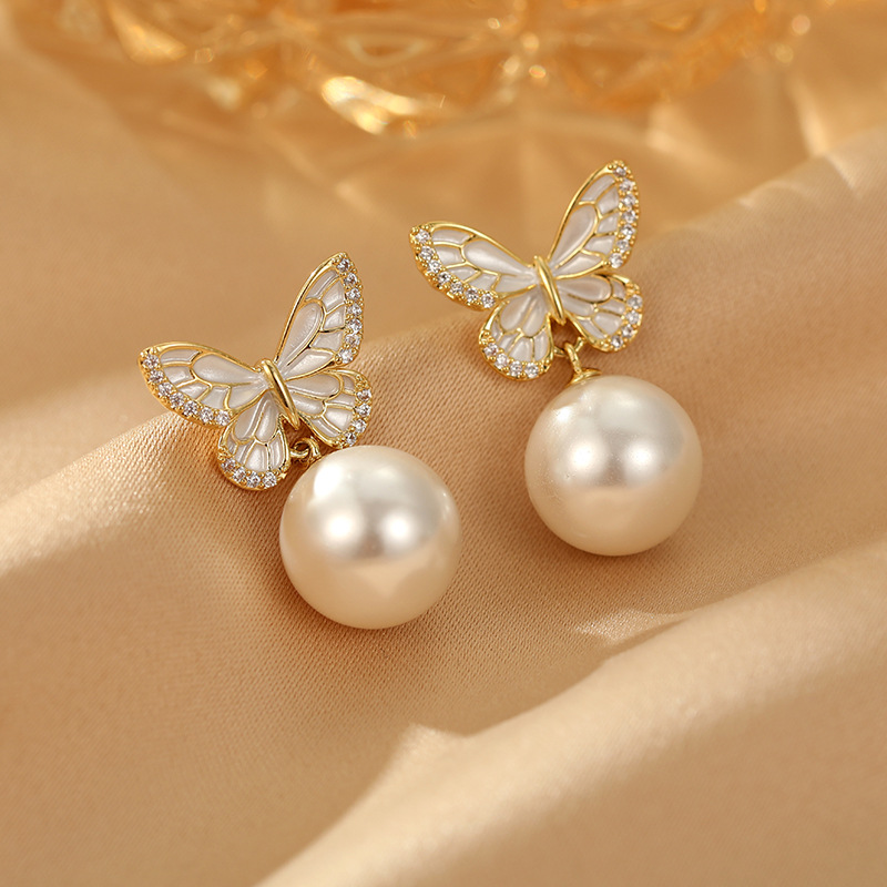 White cute brand earrings from pearl
