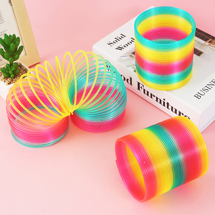 9cm bolsa de malla grande arco iris anillo Niños Primavera anillo mágico puesto Venta caliente juguetes al por mayor TikTok modelo de enseñanza