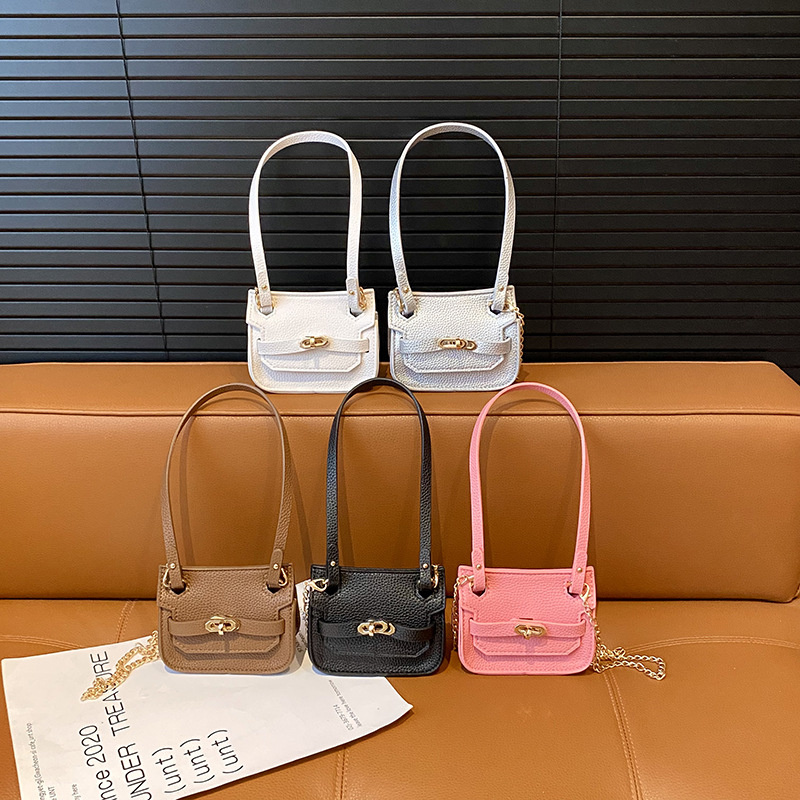 Nuevo bolso de cambio infantil coreano de moda de color sólido mini mochila de bebé comercio exterior accesorios de cadena bolsa de moda