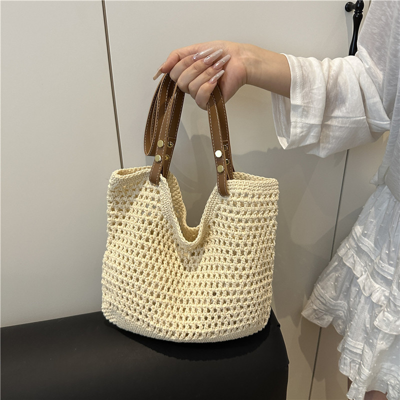 Bolsas de paja transfronterizas bolsas de mujer 2025 nueva moda simple gran capacidad bolsa de hombro hueco bolsa de playa bolsa de bolsa
