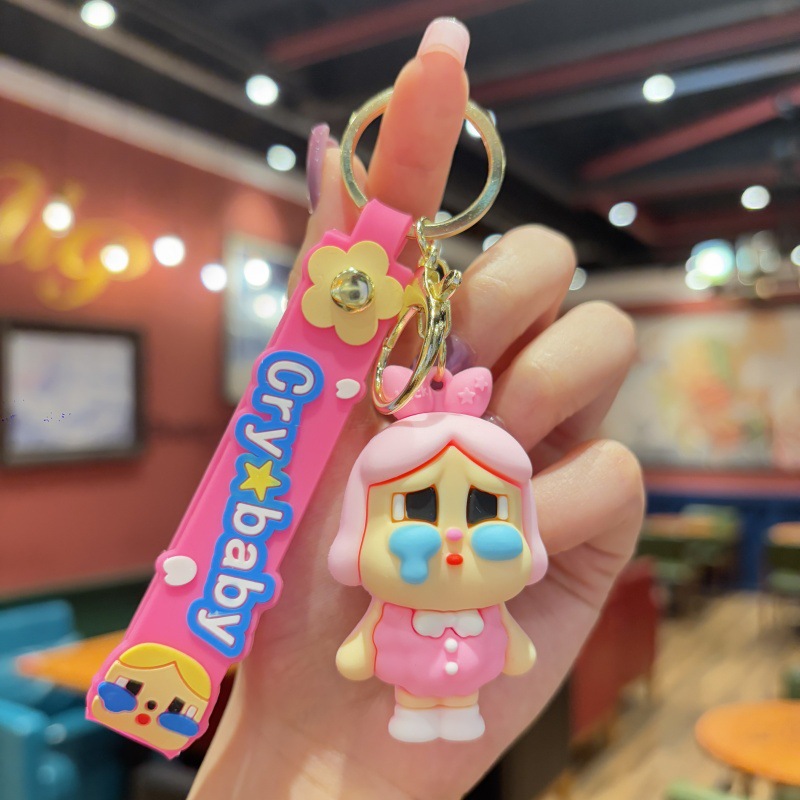 Llavero de bebé llorando de dibujos animados tridimensional linda niña mochila colgante colgante pareja llavero de coche al por mayor comercio exterior