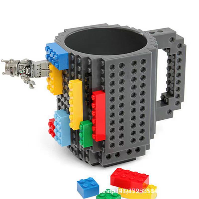 Fábrica al por mayor personalizado creativo Asamblea taza de agua educativa taza de té resistente a la gota taza de té Lego bloque de construcción