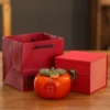 Green-covered persimmons in single cans and boxes [listed]