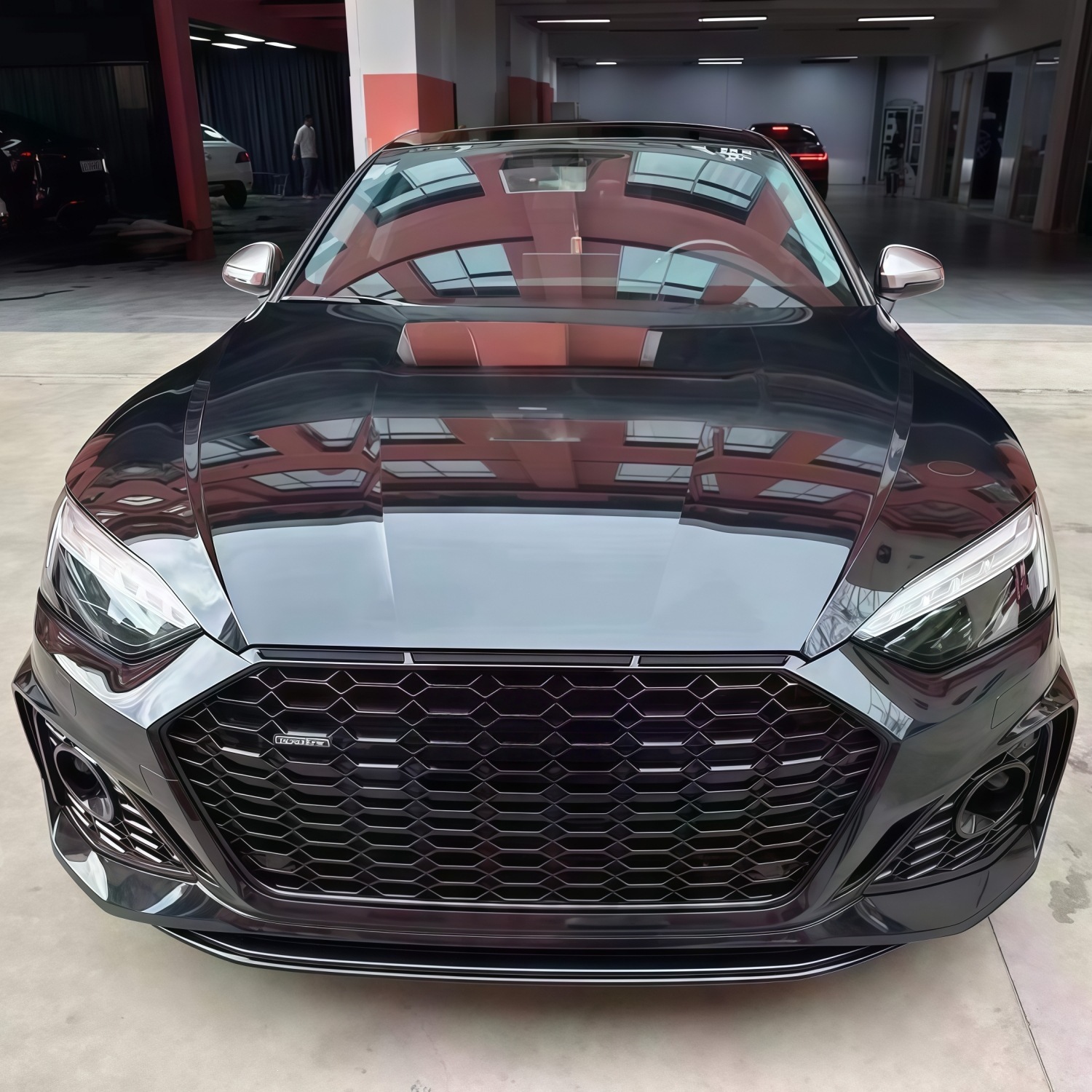 Suitable for Audi A5 2021-2024 models, RS5 rear bumper assembly, rear surround, tail lip, tail throat, and rear lower skirt, in a black finish