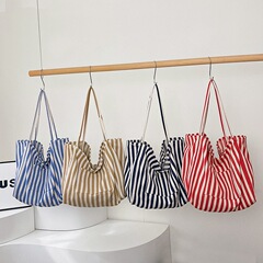 色のストライプのズックの女性の韓国の簡単なchiのショッピングバッグの新型の文芸の春と夏の小さい清新な特包の女性にぶつかります。
