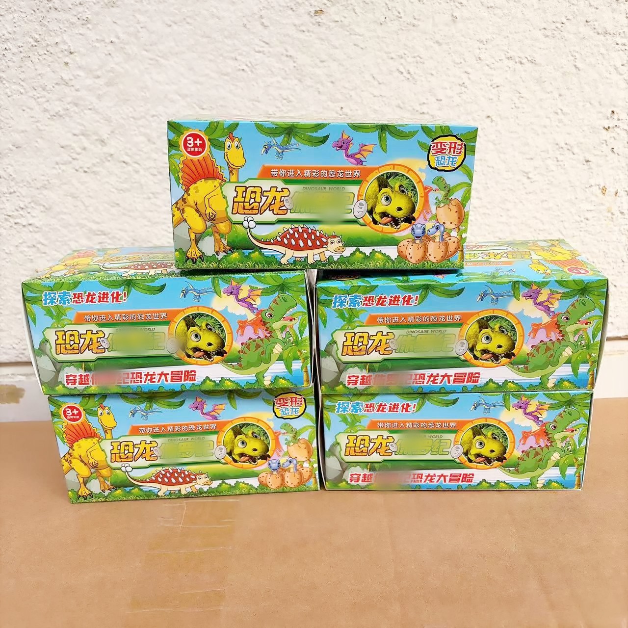 Juguetes de caja de colores para niños dinosaurios patineta deformación modelo de juguetes para niños 2 yuanes al por mayor