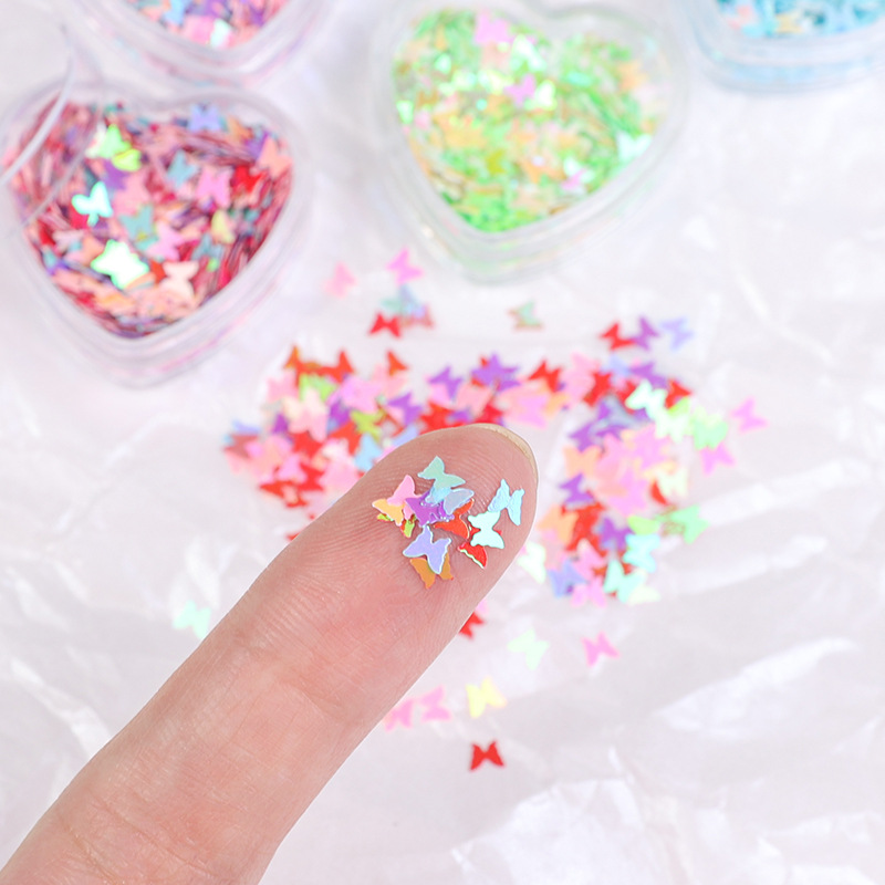 Arte de uñas Aurora mariposa lentejuelas irregulares láser corazón lentejuelas brillo de uñas color mágico accesorios de joyería en caja