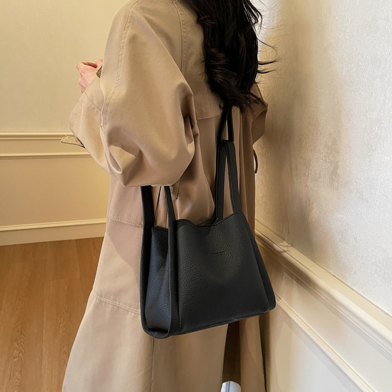 Bolsos de moda de nicho retro para mujer 2025 verano nuevo bolso de mensajero bolso de cubo de moda de alta gama bolso de hombro