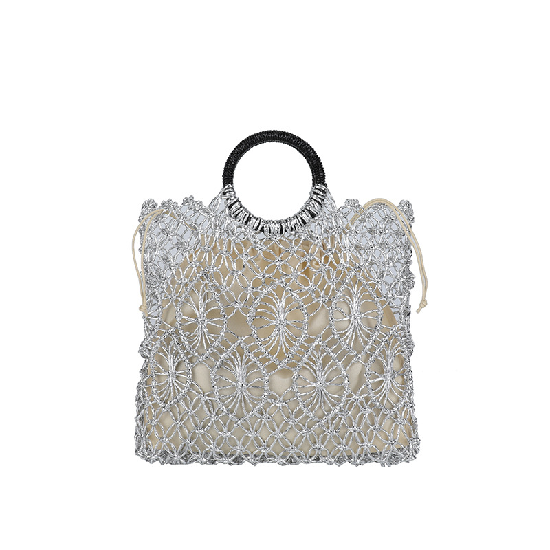 Bolso de vacaciones junto al mar 2025 verano nuevo bolso femenino bolso de playa de estilo occidental bolso tejido hueco de gran capacidad