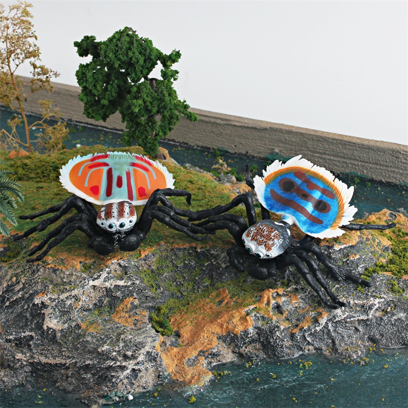 Transfronterizo de exportación simulación insecto modelo animal juguete rojo y azul salto araña Pavo Real araña patrón horizontal mosca araña adornos estáticos