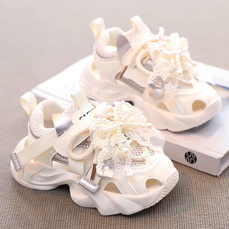Sandálias de niñas 2026 verano nuevo niño red zapatos deportivos de cabeza de pan niña princesa con suela suave zapatos de red
