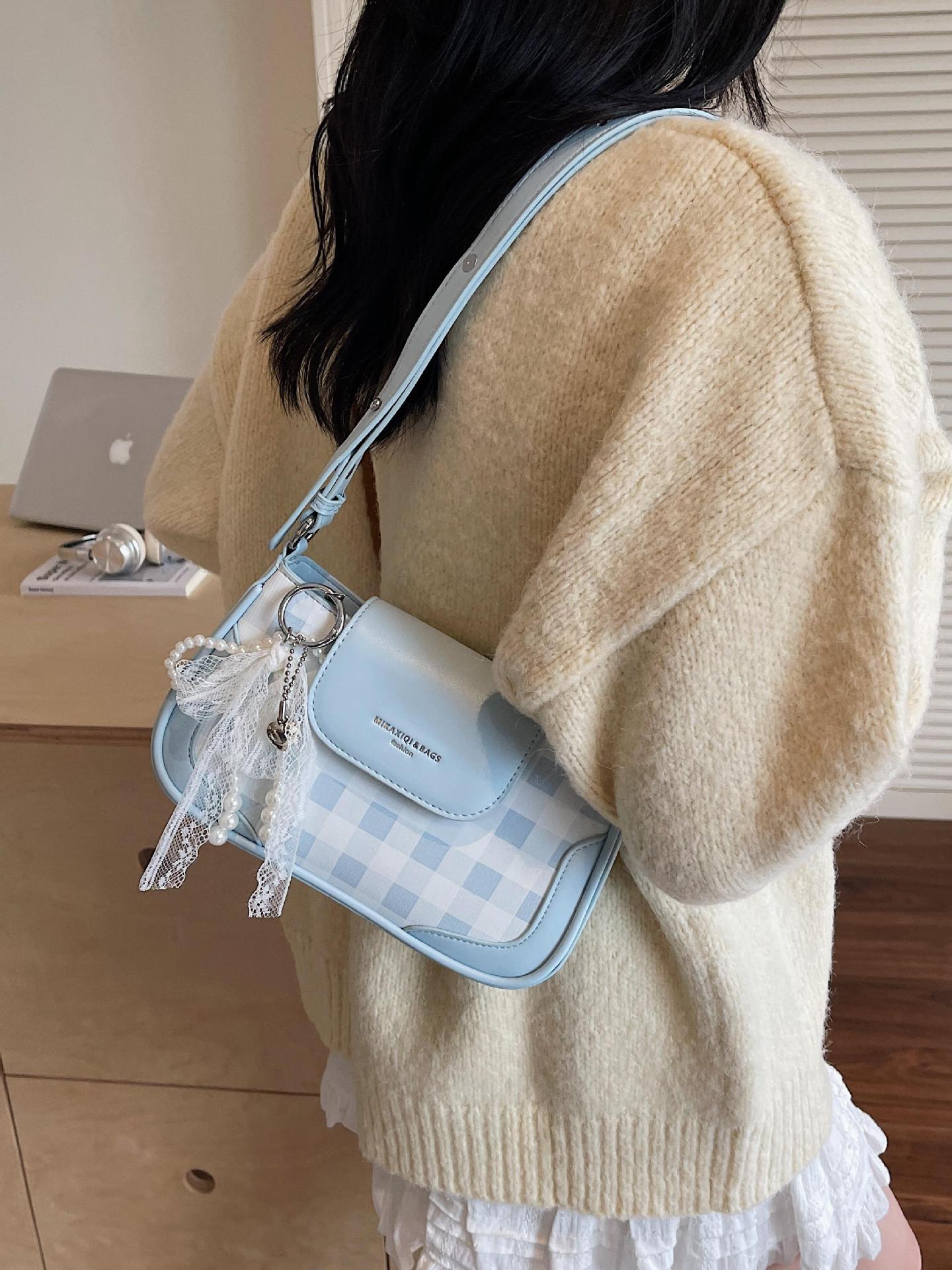 Bolso de axila de diseño de nicho a cuadros de estilo occidental 2025 nuevo bolso de hombro de todo fósforo de color en contraste bolso de mensajero de moda de alta gama