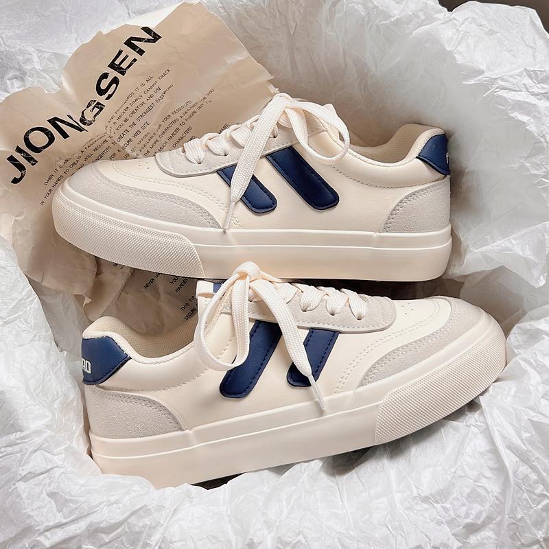 Nicho de diseño de zapatos blancos para mujeres 2025 primavera y otoño nuevos zapatos de skate de estudiantes de suela gruesa zapatos de mujer zapatos de mujer