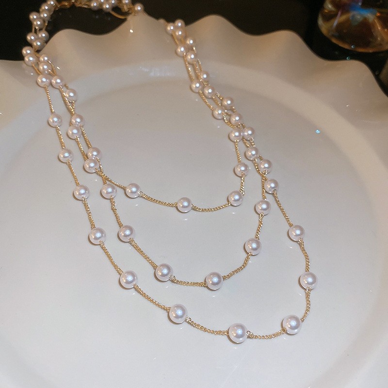 Collar con cuentas de perlas de gota de agua con diamantes transfronterizos otoño e invierno cadena de suéter de lujo ligero francés moda todo fósforo joyería de alta gama