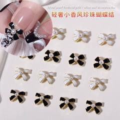 Hollywood Glamour Elegance: Chic Polished French Nail Art Decoration, Fashionable Black and White French Manicure with Butterfly Knot Design, New Trendy Nail Accessories