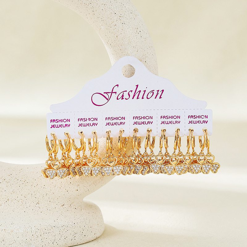 Aretes de trébol de lujo ligero en 2025 nuevo estilo de nicho de diseño de botones de orejas de borda de alta calidad de moda para mujeres aretes de orejas