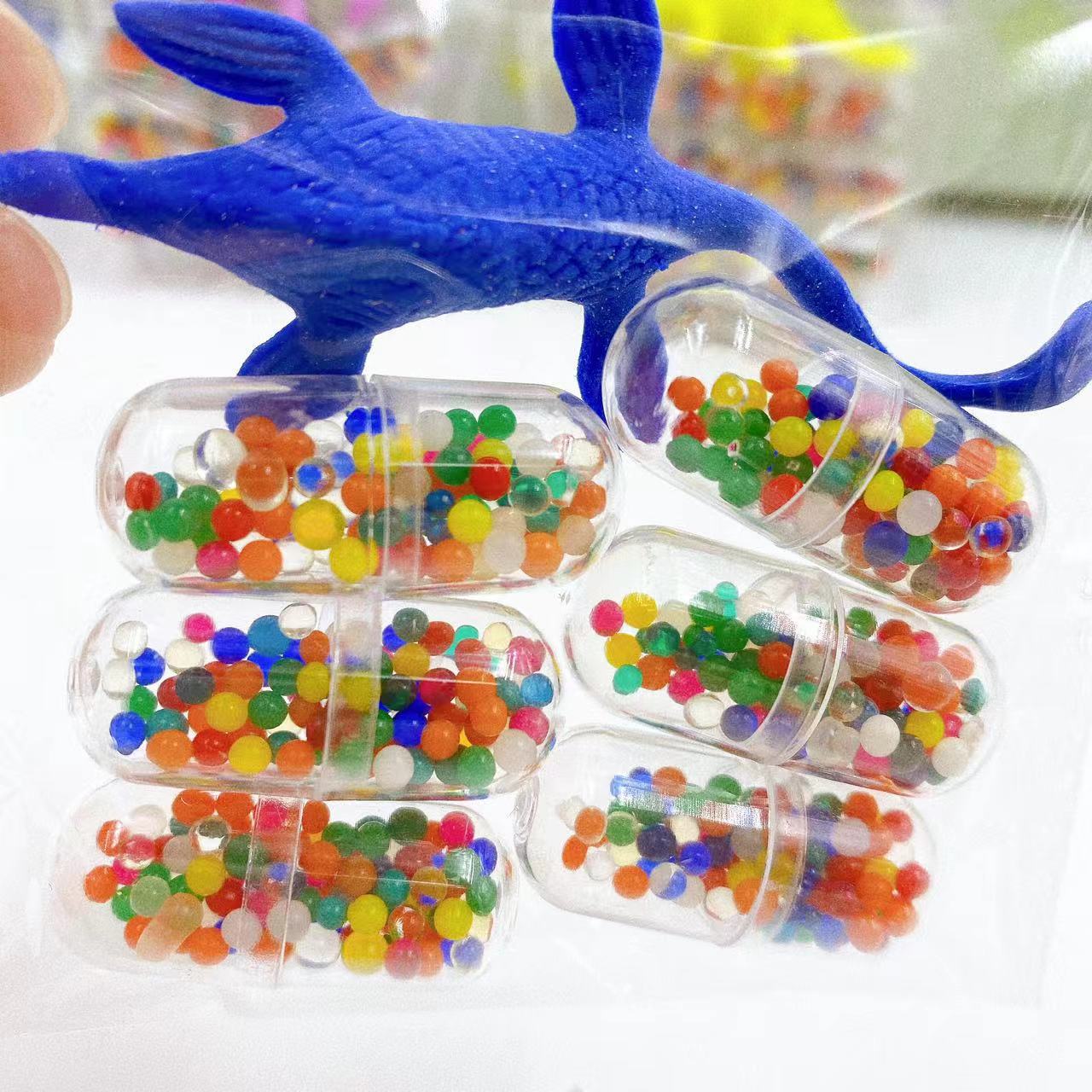 Juguetes infantiles, cápsulas de bebés marinos, perlas de absorción de agua, perlas de absorción de agua, estudiantes alrededor de la escuela de animales