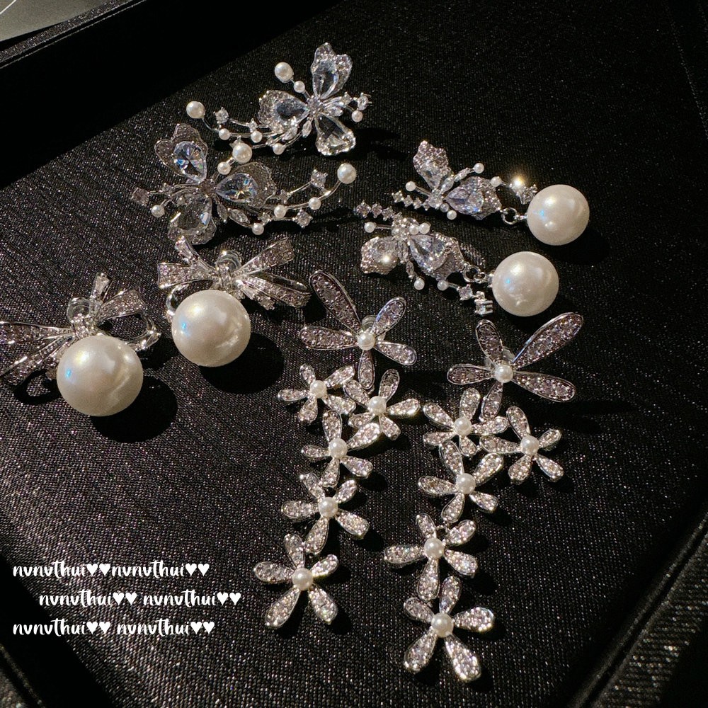 Earrings from pearl with zircon, flowered, 750 sample gold