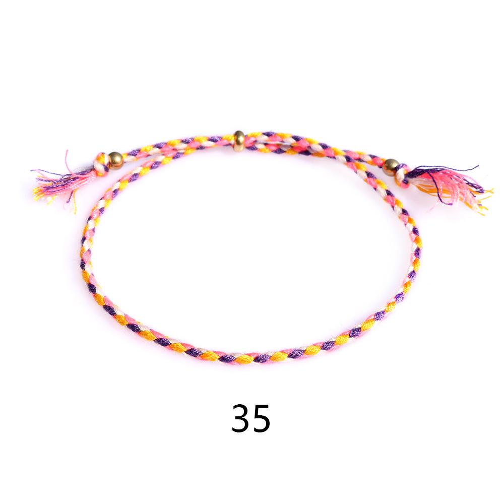 Amazon popular colorido cuerda de algodón amistad pulsera perlas de cobre borla pulsera tejida a mano ajustable hombres y mujeres pulsera