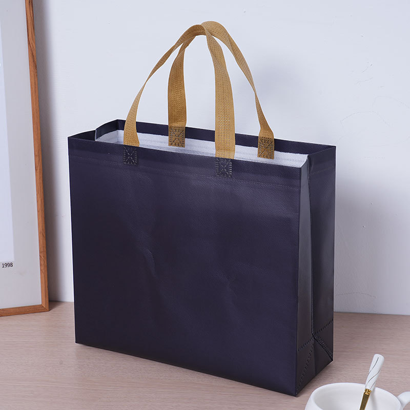 Bolsas de tela no tejida recubiertas de película personalizadas exposición bolsas de tela no tejida recubiertas de película tienda de ropa bolsas de mano personalizadas bolsas tridimensionales
