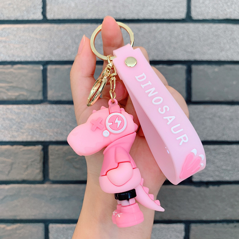 Dinosauro llavero música rayo pequeño dinosaurio muñeca de silicona bolso llavero de automóvil colgante moda regalos frescos