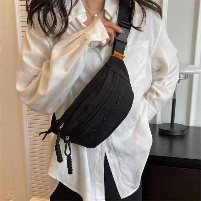 Bolso de pecho coreano de lienzo de letras mujeres 2025 nuevo bolso de hombro de estilo deportivo casual popular bolso de mochila de fuego universal